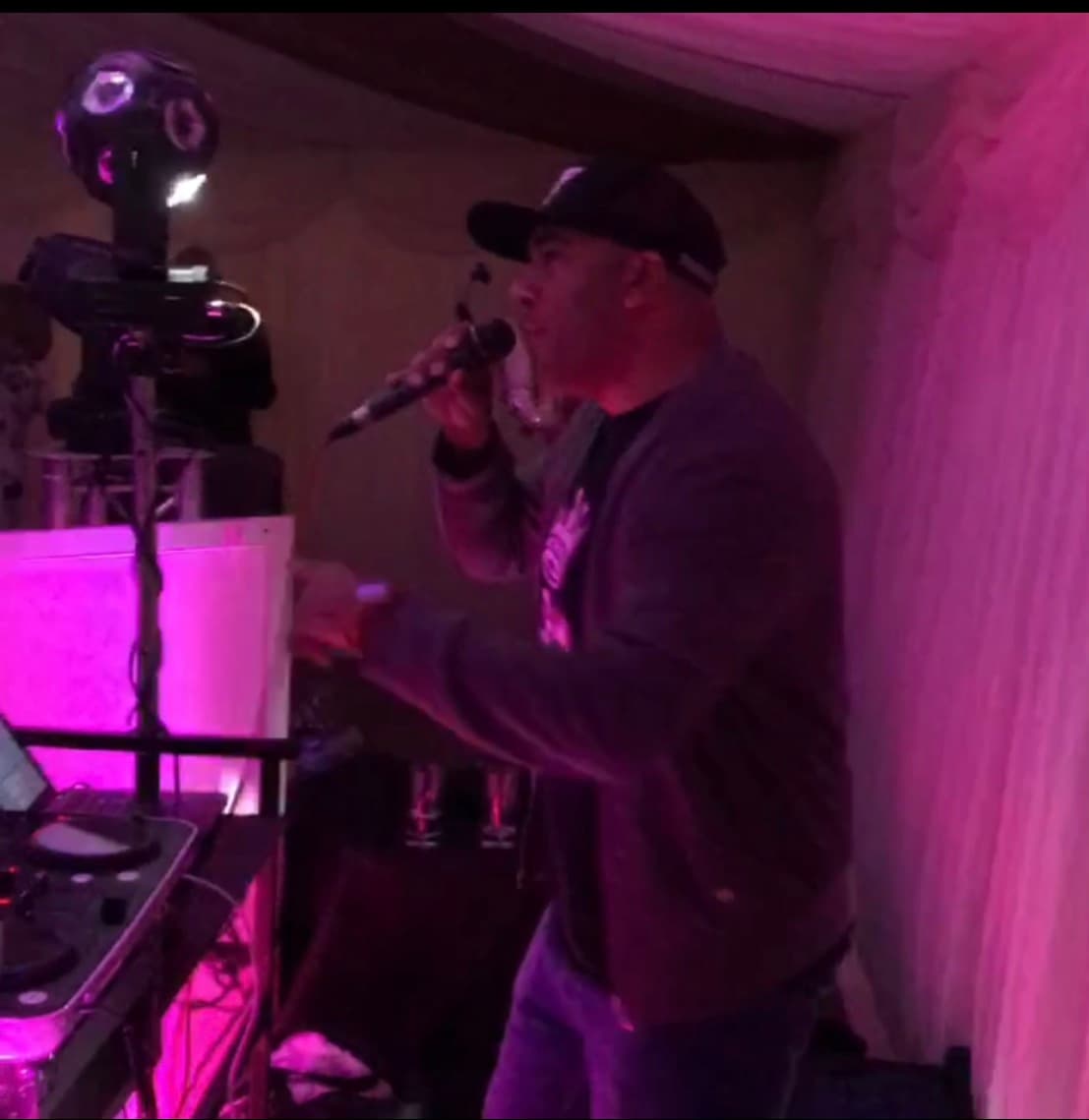 mc kie performing at a wedding