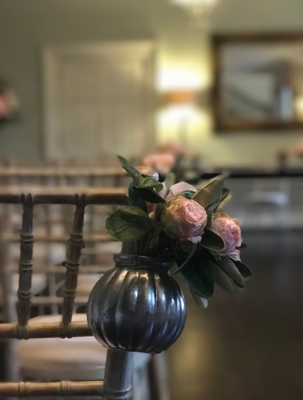 wedding flowers perched on a chair